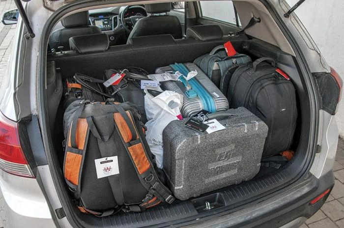 Large international luggage fitting comfortably inside Toyota Innova Hycross
